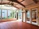 Sunny sunroom with floor-to-ceiling windows and a ceiling fan, overlooking a beautiful outdoor area at 3904 Williamson Circle, Myrtle Beach, SC 29579