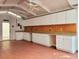 Spacious utility room with ample counter space and storage cabinets, ideal for organization and projects at 3904 Williamson Circle, Myrtle Beach, SC 29579