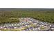 An aerial view showing the layout of this neighborhood surrounded by dense woods at 4206 Falls Oaks St., Myrtle Beach, SC 29579