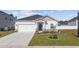 Charming single-story home featuring a manicured lawn and an attached two-car garage at 4206 Falls Oaks St., Myrtle Beach, SC 29579
