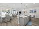 Bright open concept kitchen with hardwood floors, stainless steel appliances, island and open to the living room at 4206 Falls Oaks St., Myrtle Beach, SC 29579