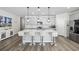 Bright kitchen featuring an island with seating, pendant lighting, and stainless steel appliances at 4206 Falls Oaks St., Myrtle Beach, SC 29579