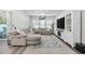 Spacious living room with a large sectional sofa, TV, and a ceiling fan at 4206 Falls Oaks St., Myrtle Beach, SC 29579