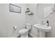 Modern powder room featuring a pedestal sink, elegant decor, and neutral tones at 4206 Falls Oaks St., Myrtle Beach, SC 29579