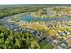 Beautiful aerial view of a waterfront community with well-manicured lawns and lush trees and winding waterways at 432 Rose Fountain Dr., Myrtle Beach, SC 29579