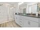 Beautiful bathroom featuring double sinks, granite counters, and a large marble tiled shower at 432 Rose Fountain Dr., Myrtle Beach, SC 29579
