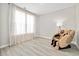 Bright bedroom with a massage chair, large window with curtains, and light colored flooring at 432 Rose Fountain Dr., Myrtle Beach, SC 29579