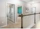 Light-filled hallway with neutral walls and trim, leading to various rooms at 434 Falling Leaf Loop, Myrtle Beach, SC 29588