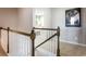 Bright hallway featuring carpeted floors, white wainscoting, and decorative wall art at 434 Falling Leaf Loop, Myrtle Beach, SC 29588