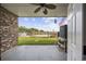Inviting outdoor space featuring a ceiling fan, lush lawn, and scenic water view, perfect for entertaining at 465 Vereen Rd. # 10, Murrells Inlet, SC 29576