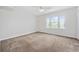 Carpeted bedroom with neutral walls, a ceiling fan, and a window with water view at 465 Vereen Rd. # 10, Murrells Inlet, SC 29576