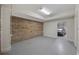 Additional space in garage area featuring exposed brick and access to main garage at 465 Vereen Rd. # 10, Murrells Inlet, SC 29576