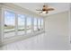 Bright sun room featuring large windows offering serene marsh views and white wood flooring at 465 Vereen Rd. # 10, Murrells Inlet, SC 29576