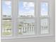 Inviting view from a window overlooking the bay, docks, and waterfront homes at 465 Vereen Rd. # 10, Murrells Inlet, SC 29576