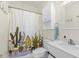 Cozy bathroom with vanity, toilet, and charming shower curtain at 4767 Wild Iris Dr. # 203, Myrtle Beach, SC 29579