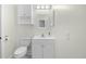 Bathroom with a modern vanity, toilet, lighting, and decorative mirror at 4767 Wild Iris Dr. # 203, Myrtle Beach, SC 29579