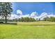 Expansive view of a manicured golf course, featuring lush green grass and mature trees under a partly cloudy sky at 4767 Wild Iris Dr. # 203, Myrtle Beach, SC 29579