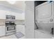 Conveniently located laundry closet off kitchen with white cabinets and stainless appliances at 4767 Wild Iris Dr. # 203, Myrtle Beach, SC 29579