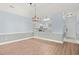 Open-concept living room with views to the kitchen, dining area, and hallway at 4767 Wild Iris Dr. # 203, Myrtle Beach, SC 29579