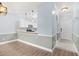 Inviting living space with modern lighting, wood floors, and seamless flow to the kitchen area at 4767 Wild Iris Dr. # 203, Myrtle Beach, SC 29579