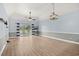 Bright, open living area with wood floors, fan and sliding glass door at 4767 Wild Iris Dr. # 203, Myrtle Beach, SC 29579