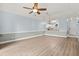 Open-concept living room with a ceiling fan and views to the kitchen and dining area at 4767 Wild Iris Dr. # 203, Myrtle Beach, SC 29579
