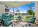 Relaxing balcony featuring comfortable seating and scenic views of the lush green landscape and community pool at 4890 Luster Leaf Circle # 201, Myrtle Beach, SC 29577