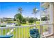 Picturesque balcony view overlooking manicured lawns, a community pool, and the distant golf course at 4890 Luster Leaf Circle # 201, Myrtle Beach, SC 29577
