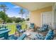 Inviting balcony with stylish outdoor furniture and views of the community's well-maintained green spaces at 4890 Luster Leaf Circle # 201, Myrtle Beach, SC 29577