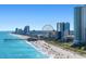 Beautiful scenic beach view with skyscrapers and a ferris wheel by the pier and clear blue water at 4890 Luster Leaf Circle # 201, Myrtle Beach, SC 29577
