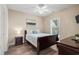 Charming bedroom with a queen bed, ceiling fan, side tables, and a window providing natural light at 4890 Luster Leaf Circle # 201, Myrtle Beach, SC 29577