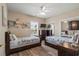 Inviting bedroom with two beds, ceiling fan, dresser with TV, and ample natural light from the window at 4890 Luster Leaf Circle # 201, Myrtle Beach, SC 29577