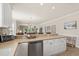 Kitchen featuring breakfast bar overlooking living area with neutral color palette and modern appliances at 4890 Luster Leaf Circle # 201, Myrtle Beach, SC 29577