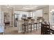 Modern kitchen with breakfast bar, stainless appliances, and seamless flow to the dining area at 4890 Luster Leaf Circle # 201, Myrtle Beach, SC 29577