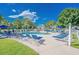 Inviting community pool surrounded by lounge chairs, palm trees, and well-maintained landscaping at 4890 Luster Leaf Circle # 201, Myrtle Beach, SC 29577