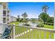 Balcony view capturing the pool area, green lawns, and attractive architecture of the surrounding buildings at 4890 Luster Leaf Circle # 201, Myrtle Beach, SC 29577