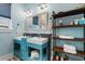 Charming bathroom with double sinks, unique faucets, custom cabinets, and open shelving at 4900 N Ocean Blvd., Myrtle Beach, SC 29577