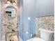 Unique half bath with a custom sink made from a vintage moped and decorative tile at 4900 N Ocean Blvd., Myrtle Beach, SC 29577