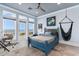 Coastal bedroom features beach views, blue accents, a hanging chair, and a cozy rug for a relaxing retreat at 4900 N Ocean Blvd., Myrtle Beach, SC 29577