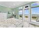 Charming bedroom with ocean views, desk, and a cheerful ambiance for a comfortable living space at 4900 N Ocean Blvd., Myrtle Beach, SC 29577