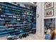 Custom shoe closet with colorful shelves offering ample storage for shoes and accessories at 4900 N Ocean Blvd., Myrtle Beach, SC 29577
