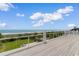 Expansive deck offering breathtaking ocean views and an inviting space for outdoor relaxation and entertaining at 4900 N Ocean Blvd., Myrtle Beach, SC 29577