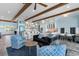 Open concept living area with exposed wood beams, ocean view, and comfortable seating for entertaining guests at 4900 N Ocean Blvd., Myrtle Beach, SC 29577
