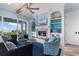 Comfortable living room featuring a fireplace, built-in shelving, ocean views, and patterned armchairs at 4900 N Ocean Blvd., Myrtle Beach, SC 29577