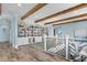 Elegant living room featuring exposed wood beams, custom built-in bookcase, and beautiful wood flooring at 4900 N Ocean Blvd., Myrtle Beach, SC 29577