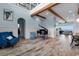 Bright and airy living room featuring wood flooring, a grand piano, and beams for architectural detail at 4900 N Ocean Blvd., Myrtle Beach, SC 29577