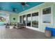 Inviting covered patio with ample seating, ceiling fans, and panoramic views through sliding glass doors at 4900 N Ocean Blvd., Myrtle Beach, SC 29577