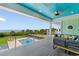 Expansive porch with ocean views, pool, comfortable seating, and ceiling fans for outdoor relaxation at 4900 N Ocean Blvd., Myrtle Beach, SC 29577