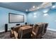 Home theater with comfortable seating, large screen, and surround sound system for immersive entertainment at 4900 N Ocean Blvd., Myrtle Beach, SC 29577
