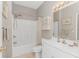 Bright bathroom featuring a shower and bathtub combo, vanity, and storage cabinet at 503 20Th Ave. N # 15B, North Myrtle Beach, SC 29582